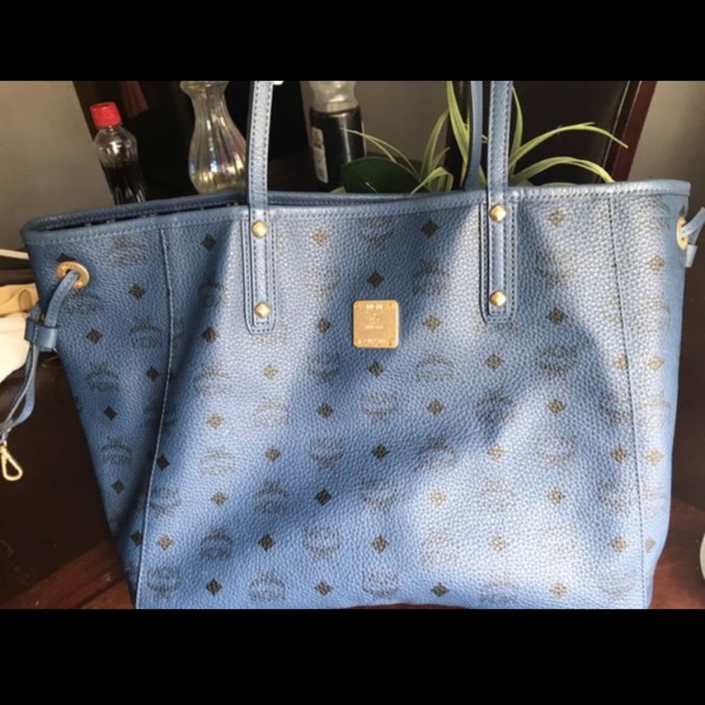 Blue MCM bag with wristlet